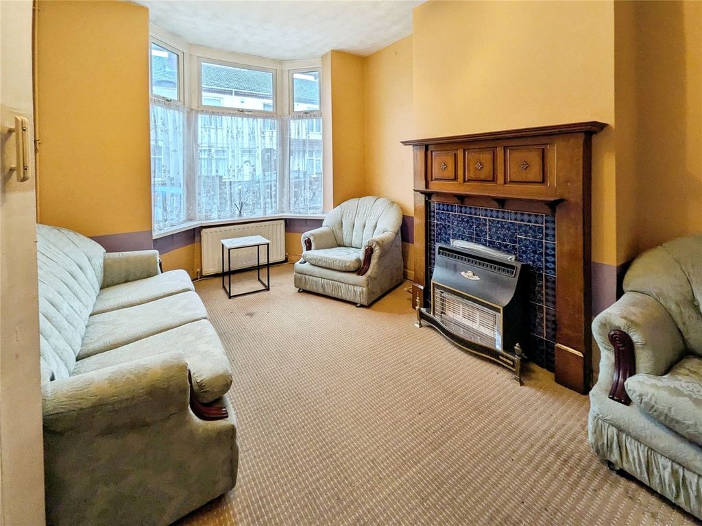 Property photo 2 of 12 Front Living Room