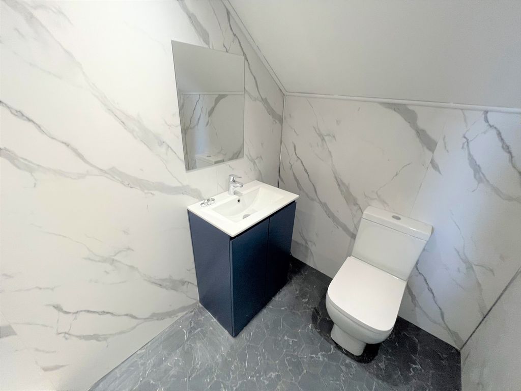 Property photo 3 of 20 A Modern And Stylish Bathroom Featuring Elegant Ma...