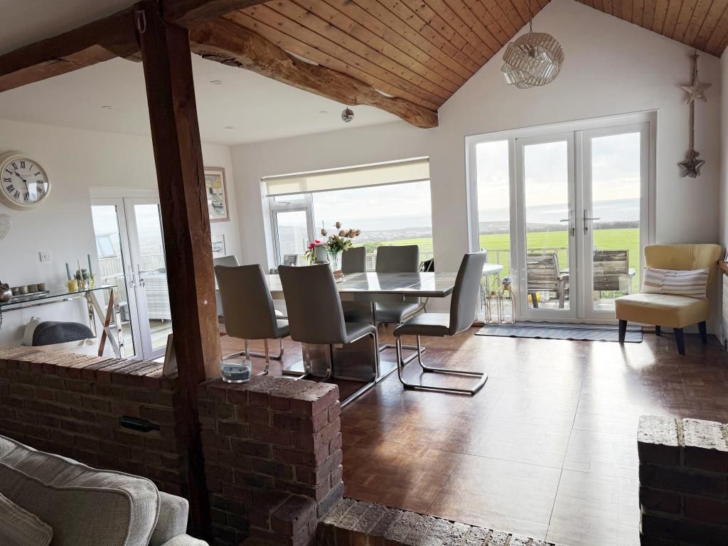 Property photo 3 of 12 Living Area With Fireplace And Wooden Flooring
