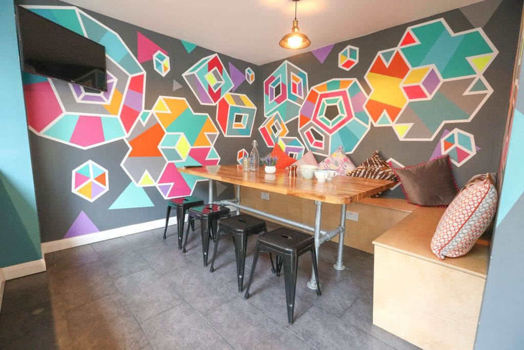 Property photo 1 of 5 A Vibrant And Stylish Living Room With A Geometric...