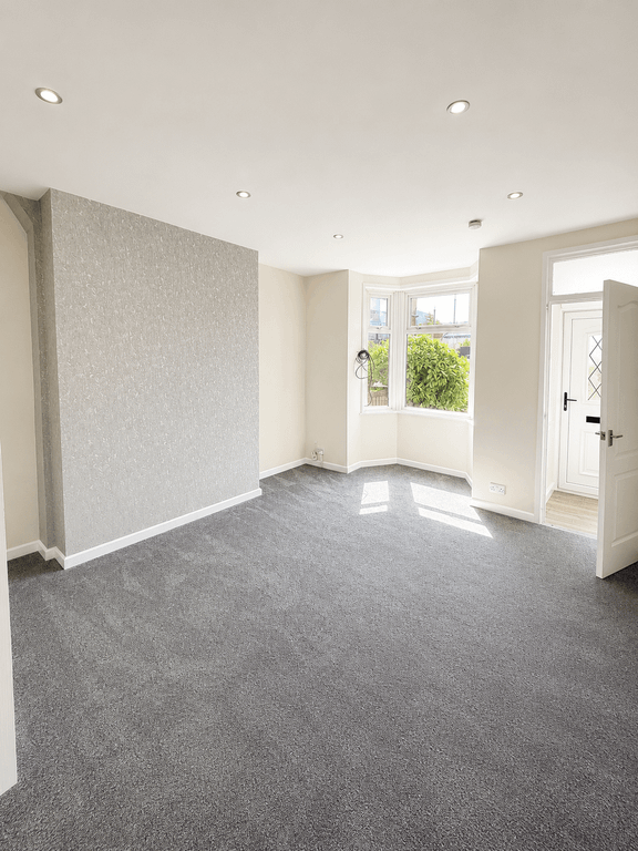 Property photo 1 of 15 Living Room (Kitchen Door Angle)