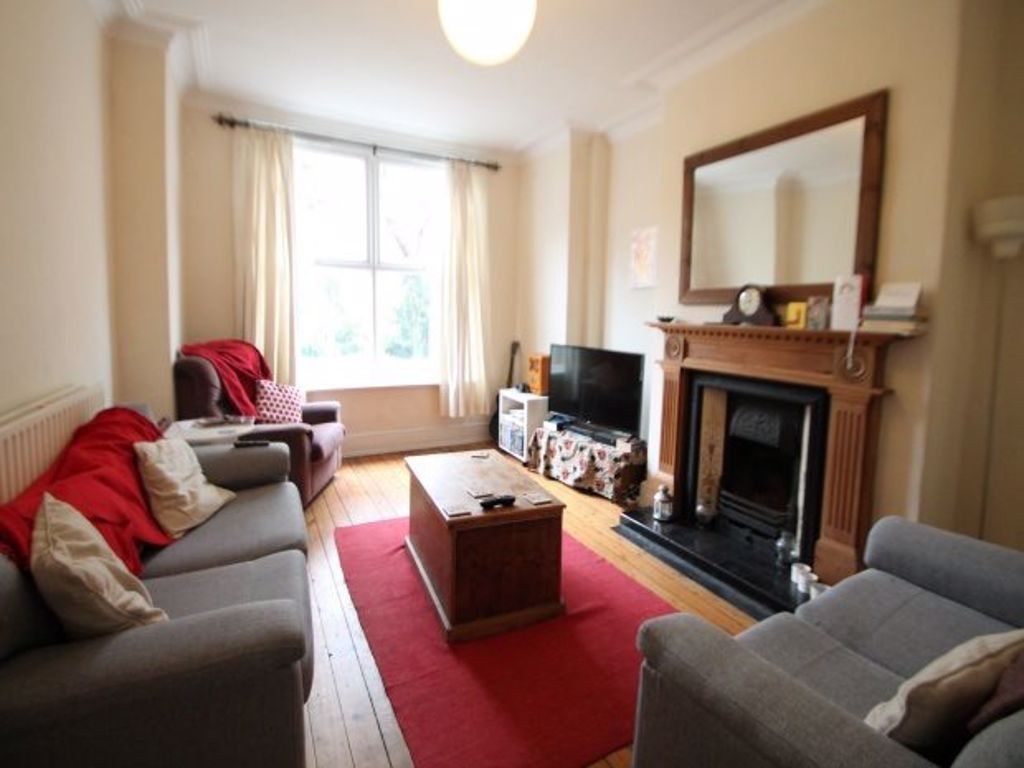 Property photo 2 of 17 A Cozy And Inviting Living Room Featuring Comforta...