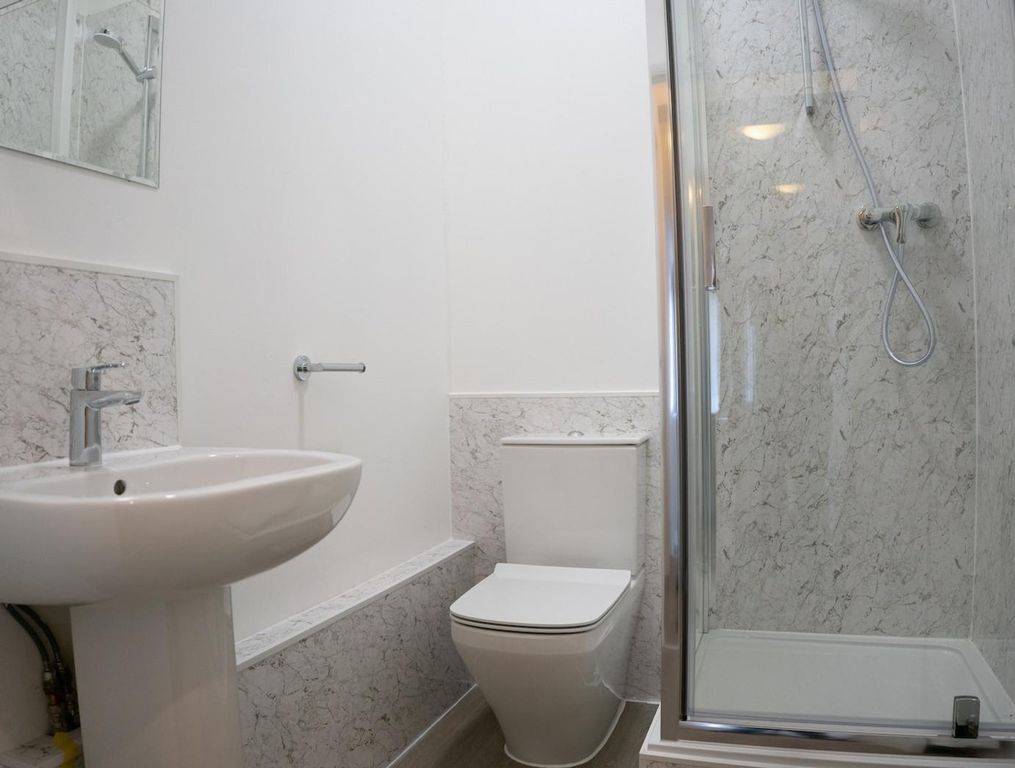 Property photo 2 of 12 A Modern And Clean Bathroom Featuring A Stylish Sh...