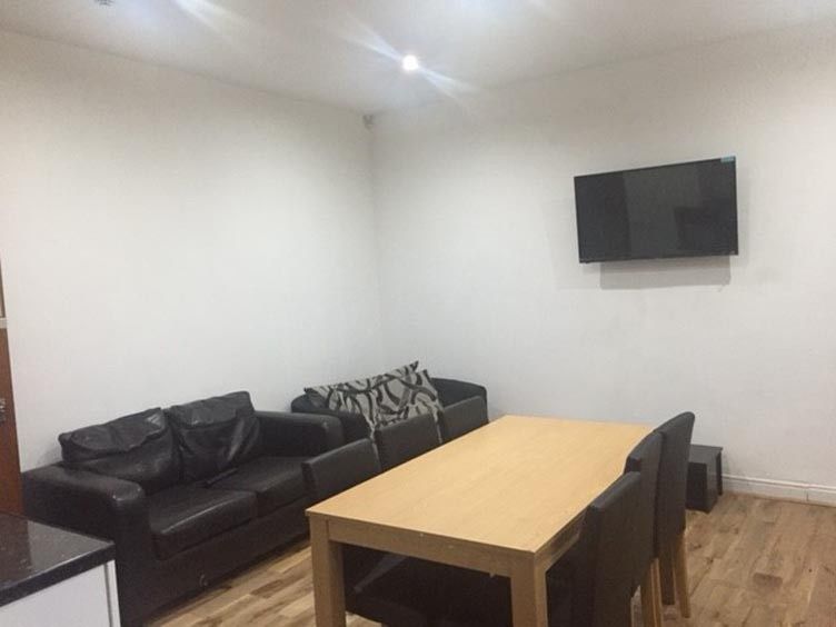 Property photo 1 of 14 Furnished Living Room Featuring A Comfortable Blac...