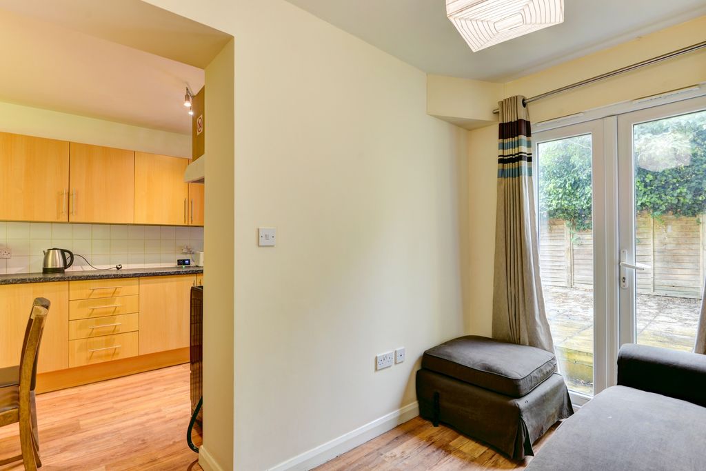 Property photo 1 of 11 A Bright And Welcoming Living Room Featuring A Com...