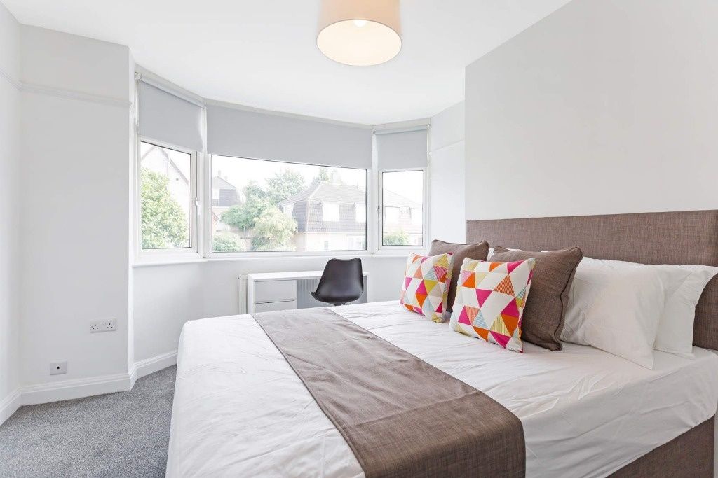 Property photo 2 of 10 Bright And Airy Master Bedroom Featuring A Large d...