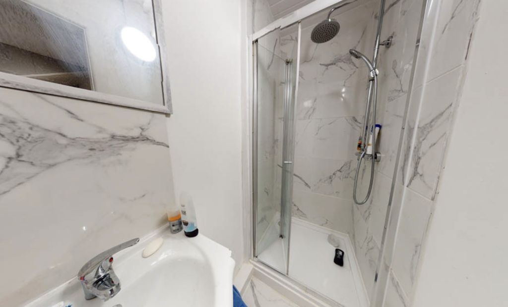 Property photo 3 of 8 A Modern Bathroom Featuring A Large Shower Enclosu...