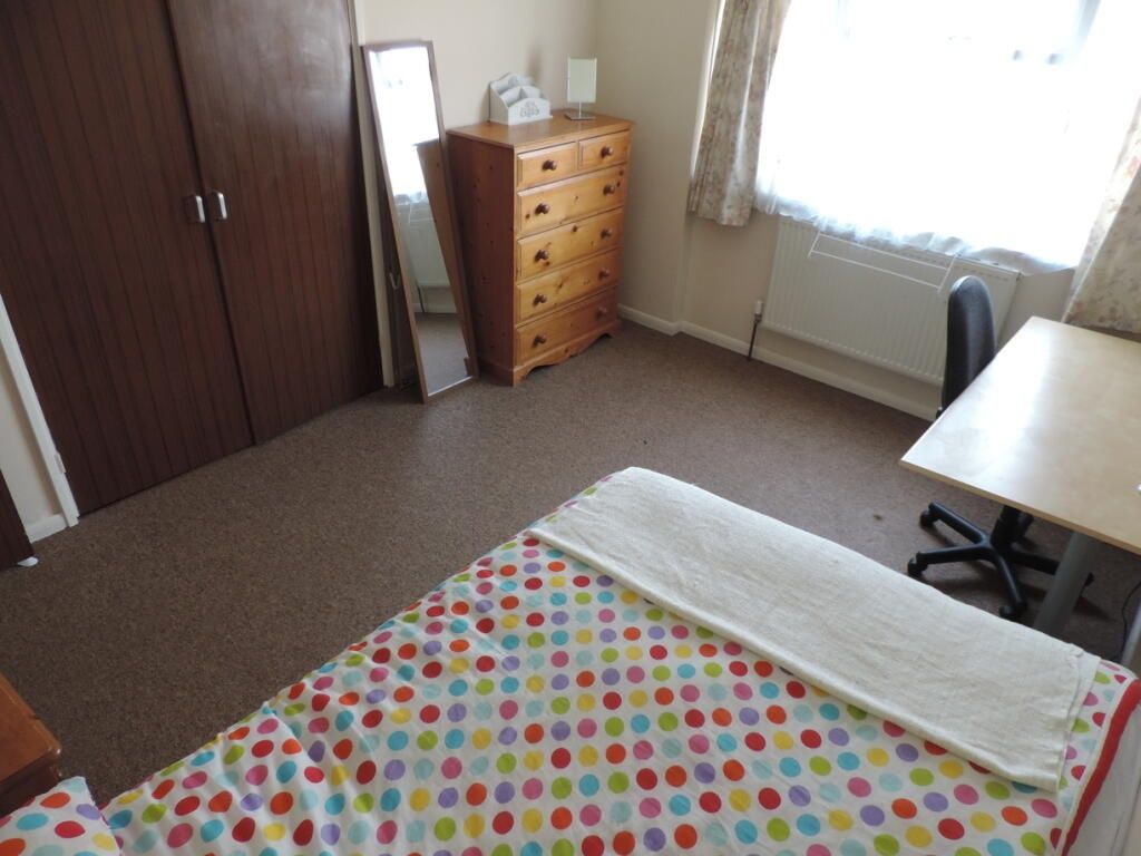 Property photo 1 of 5 Bright Bedroom With Ample Storage And Desk Space...