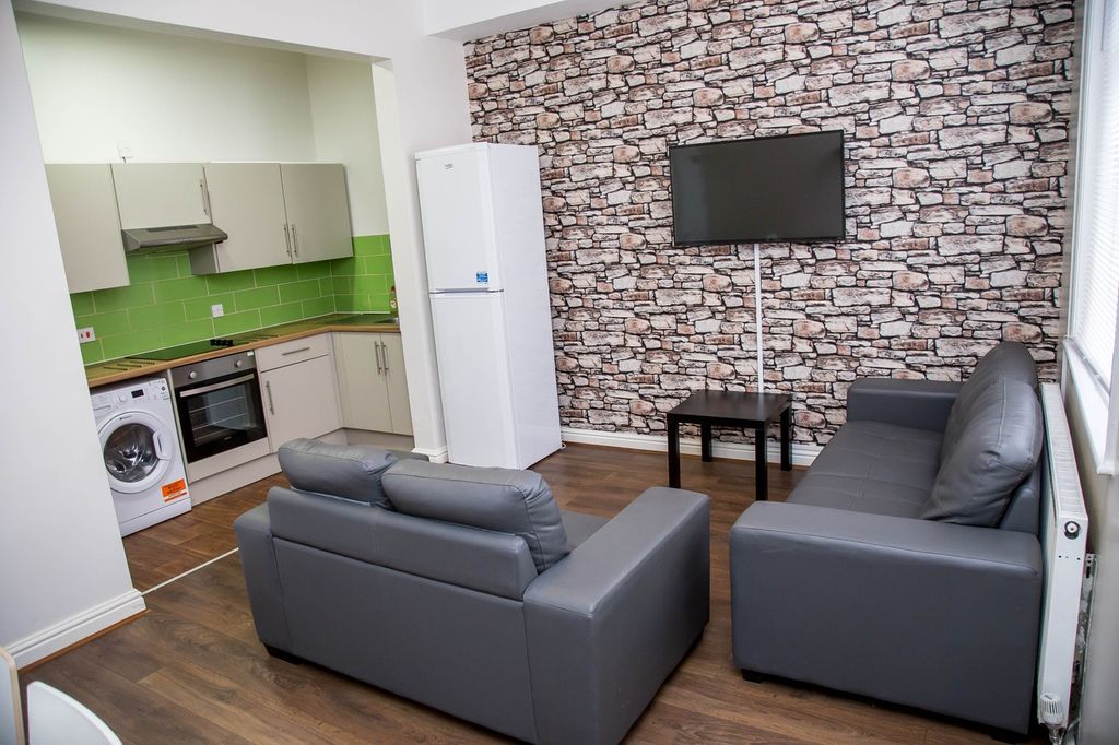 Property photo 1 of 12 This Contemporary Living Room Features A Stylish d...