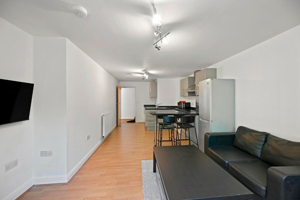Property photo 3 of 12 Modern Living Room With A Sleek Black Leather Sofa...