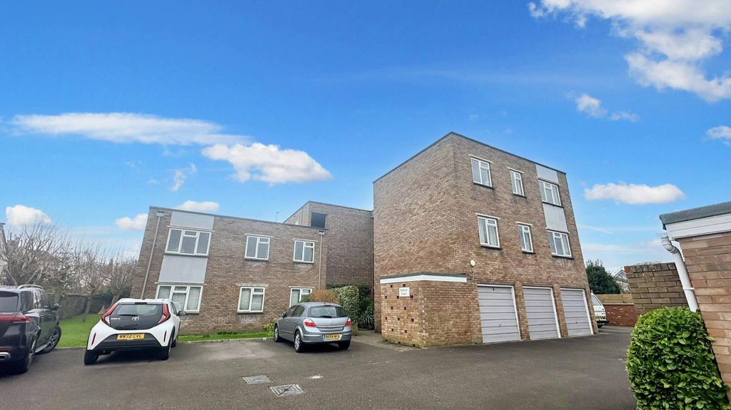 Property photo 1 of 5 Bright Exterior With Ample Parking And Blue Sky...