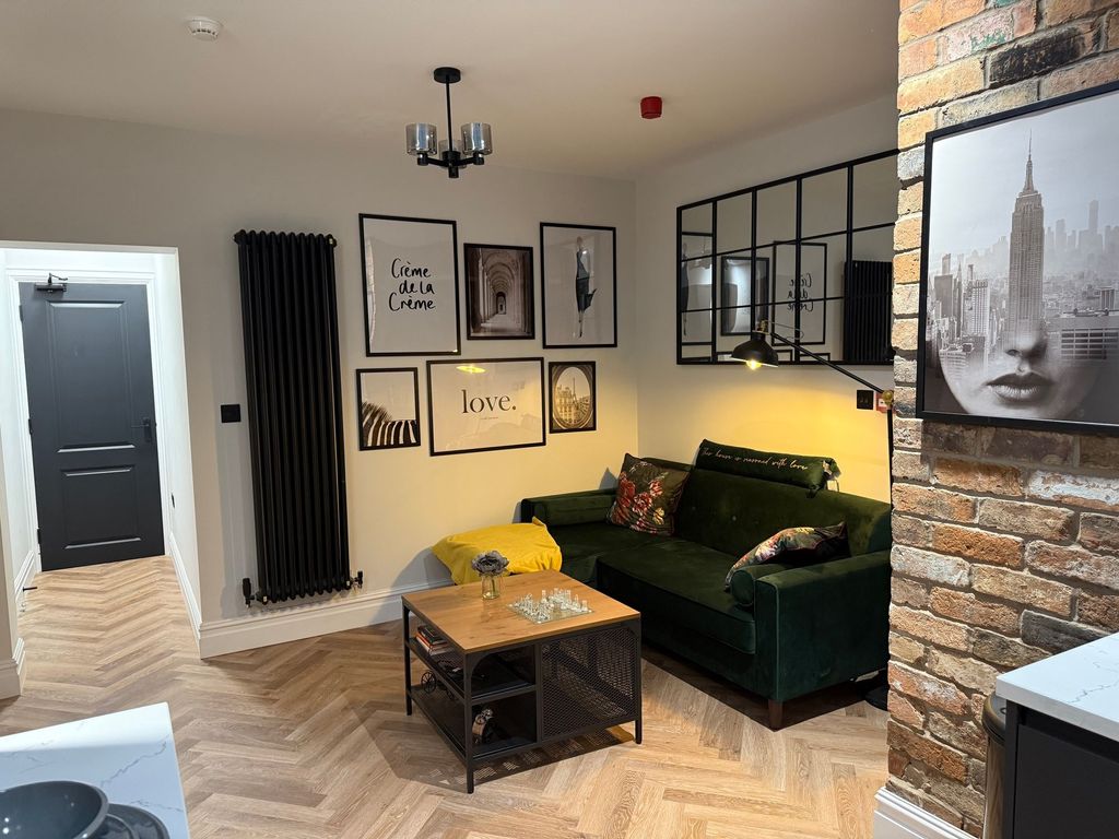 Property photo 1 of 8 Stylish And Cozy Living Room Featuring Modern Deco...