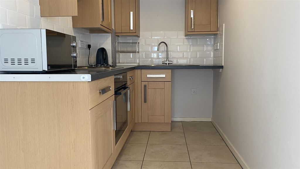 Property photo 2 of 10 Kitchen Area