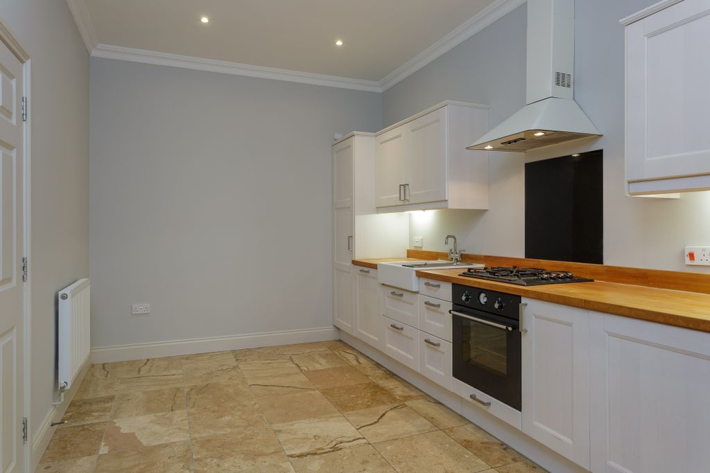 Property photo 3 of 12 Kitchen