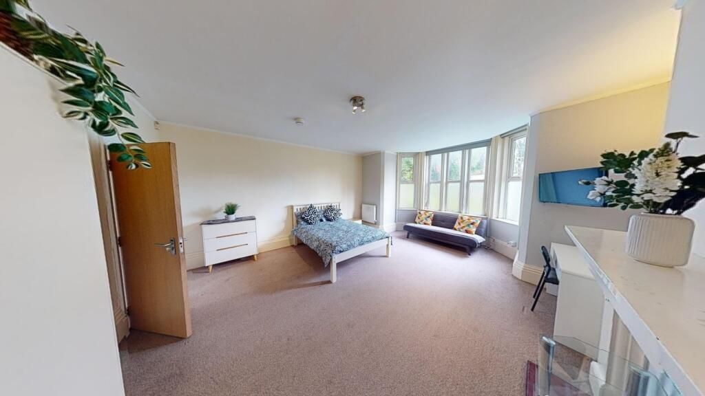 Property photo 1 of 9 A Spacious And Inviting Master Bedroom Featuring A...