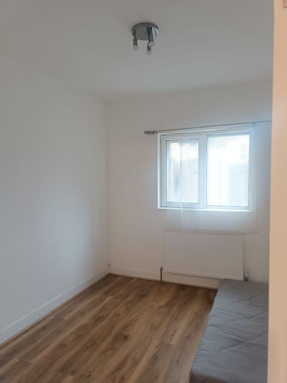 Property photo 1 of 4 Bright Bedroom With Sleek Wood-Style Flooring...