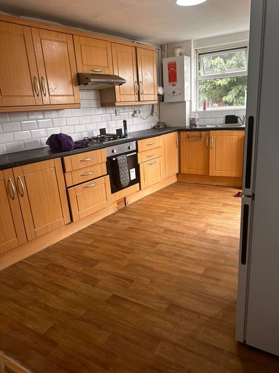 Property photo 3 of 15 Spacious Kitchen With Ample Storage And Sunlight...