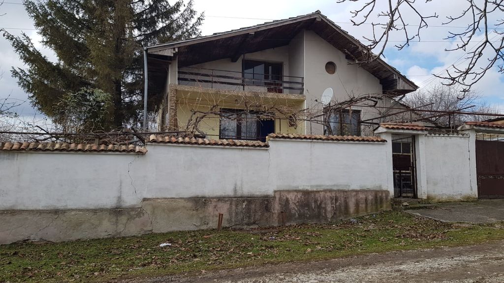 Property photo 2 of 100 Front Facade Of A Two-Storey Bulgarian House With Balcony And White Garden Wall
