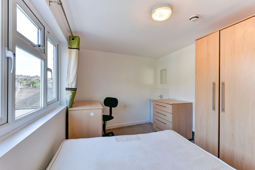 Property photo 1 of 14 A Well-Lit And Tidy Bedroom With A Large Window Pr...