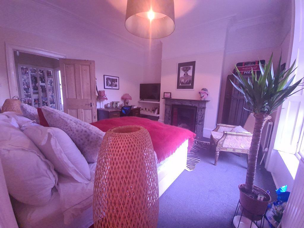 Property photo 2 of 24 A Bright And Spacious Living Room Featuring Comfor...