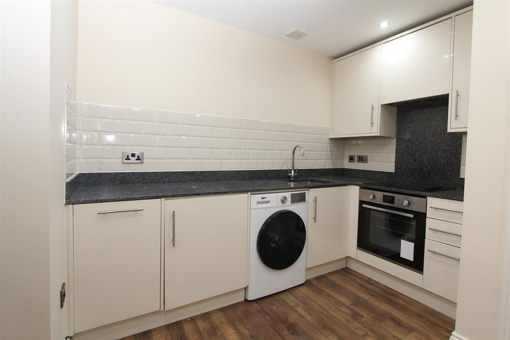 Property photo 2 of 6 Modern Kitchen With Sleek Units And Appliances...