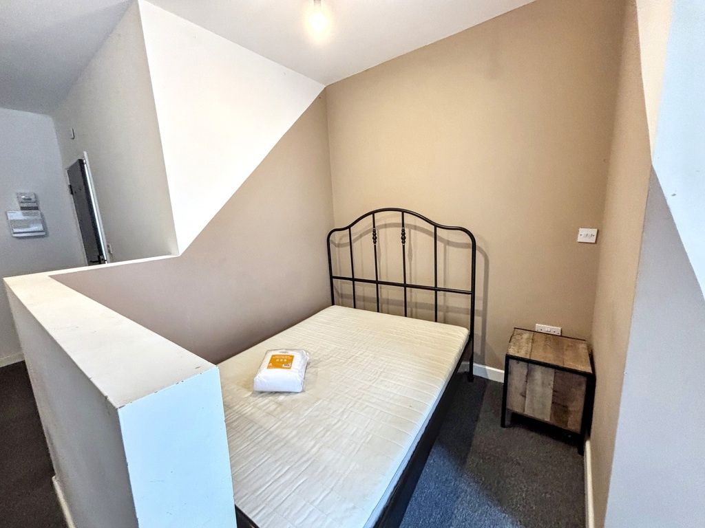 Property photo 1 of 7 A Cozy Single Bedroom Featuring A Simple Metal Bed...