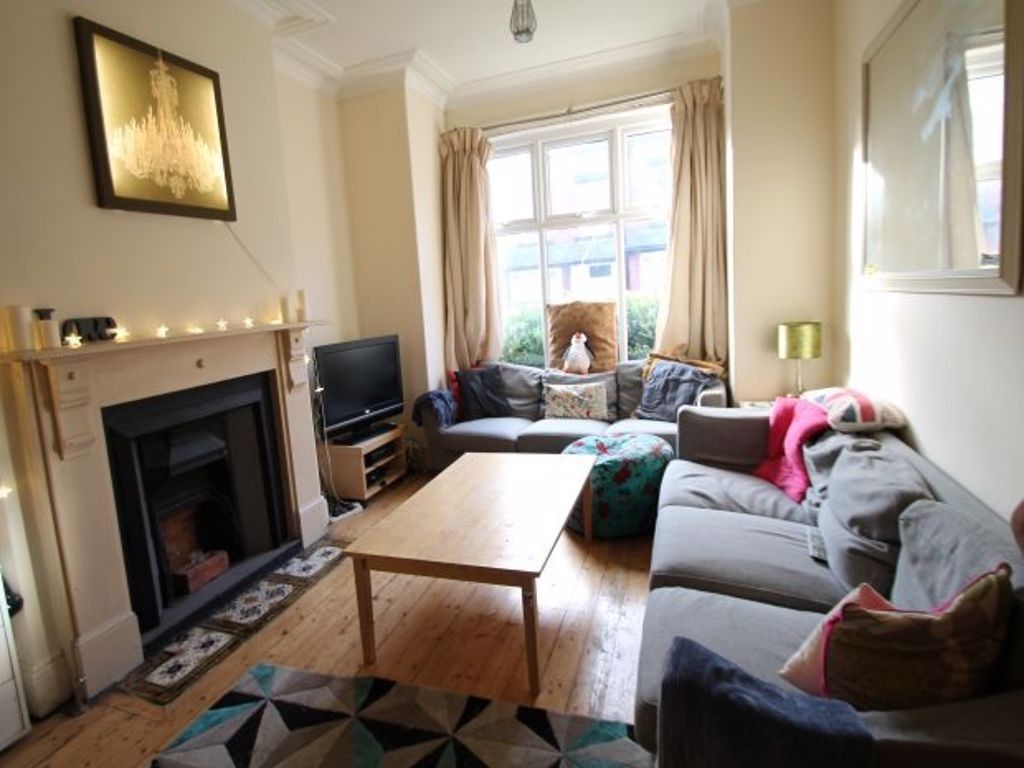 Property photo 1 of 15 A Bright And Welcoming Living Room Featuring Comfo...