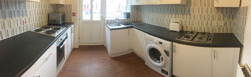 Property photo 3 of 15 Modern Galley-Style Kitchen With Fitted Appliances...