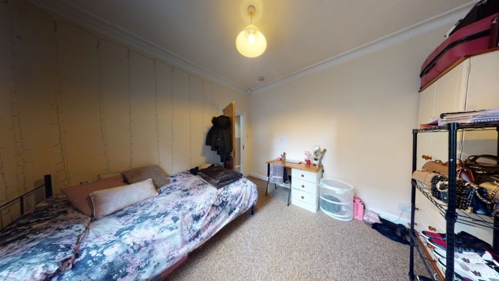 Property photo 1 of 8 Cozy Single Bedroom Featuring A Comfortable Bed Wi...