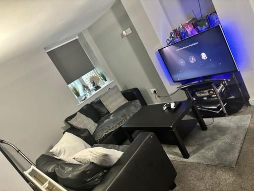 Property photo 1 of 16 A Modern, Well-Maintained Living Room Featuring A ...