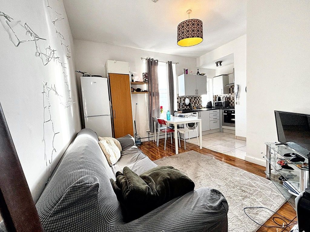 Property photo 2 of 15 Bright Open-Plan Living Area With A Comfortable So...