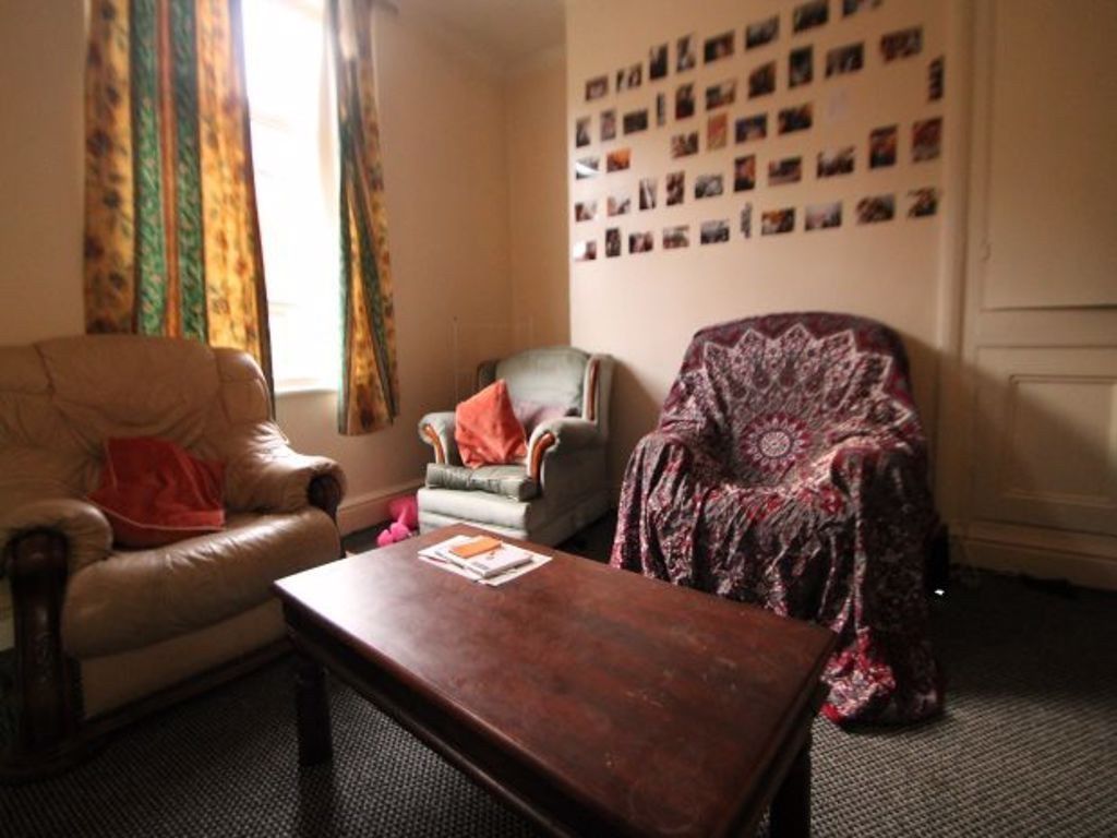 Property photo 3 of 36 A Cozy Living Room Featuring A Comfortable Sofa, A...