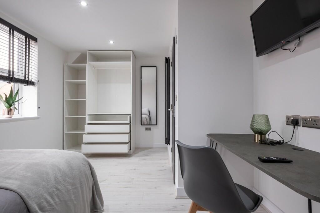 Property photo 2 of 15 Bright And Modern Master Bedroom Featuring A Comfo...