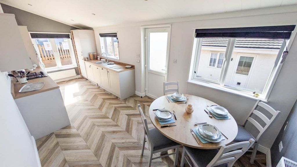 Property photo 2 of 11 Dining Area With Modern Kitchen And Large Windows