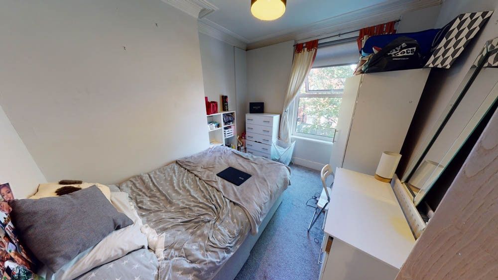 Property photo 2 of 8 A Cozy Single Bedroom Featuring A Comfortable Bed,...