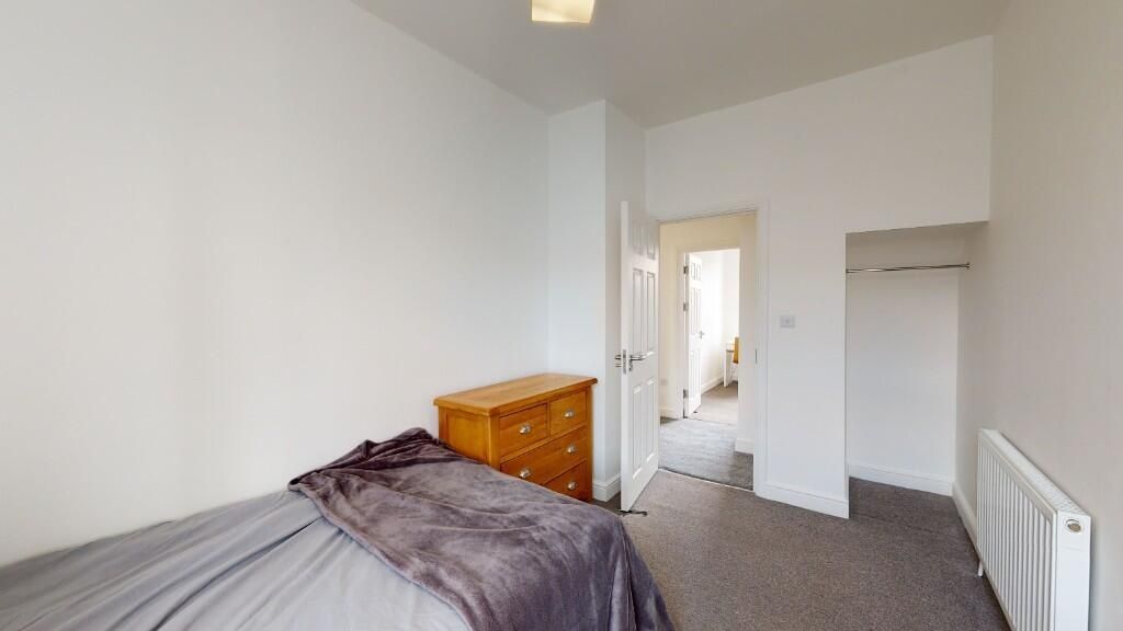 Property photo 1 of 11 A Neat And Tidy Single Bedroom Featuring A Bed Wit...