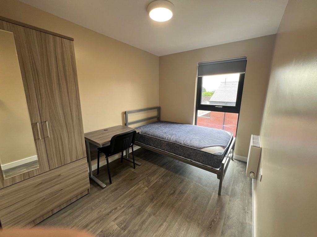Property photo 1 of 8 A Well-Lit, Clean Single Bedroom Featuring A Bed W...