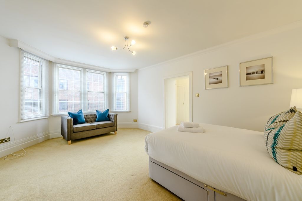Property photo 3 of 23 Spacious Master Bedroom Featuring Large Windows Th...