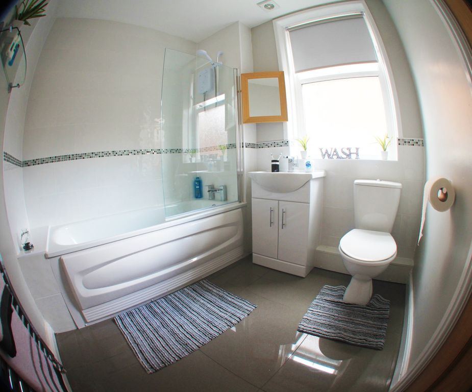 Property photo 3 of 12 A Bright And Well-Maintained Bathroom Featuring A ...