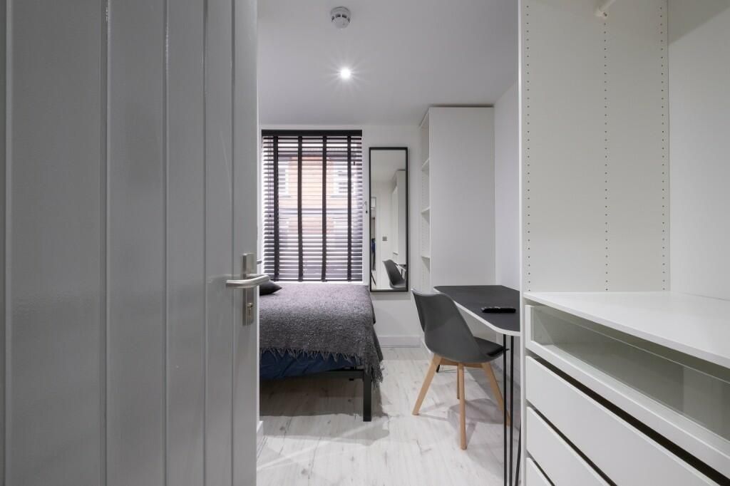 Property photo 2 of 15 Bright, Modern Bedroom With A Neatly Made Double B...