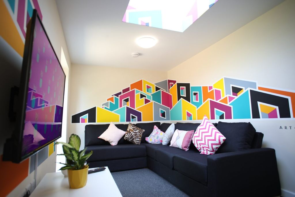 Property photo 3 of 5 Contemporary Lounge With A Large Black L-Shaped So...