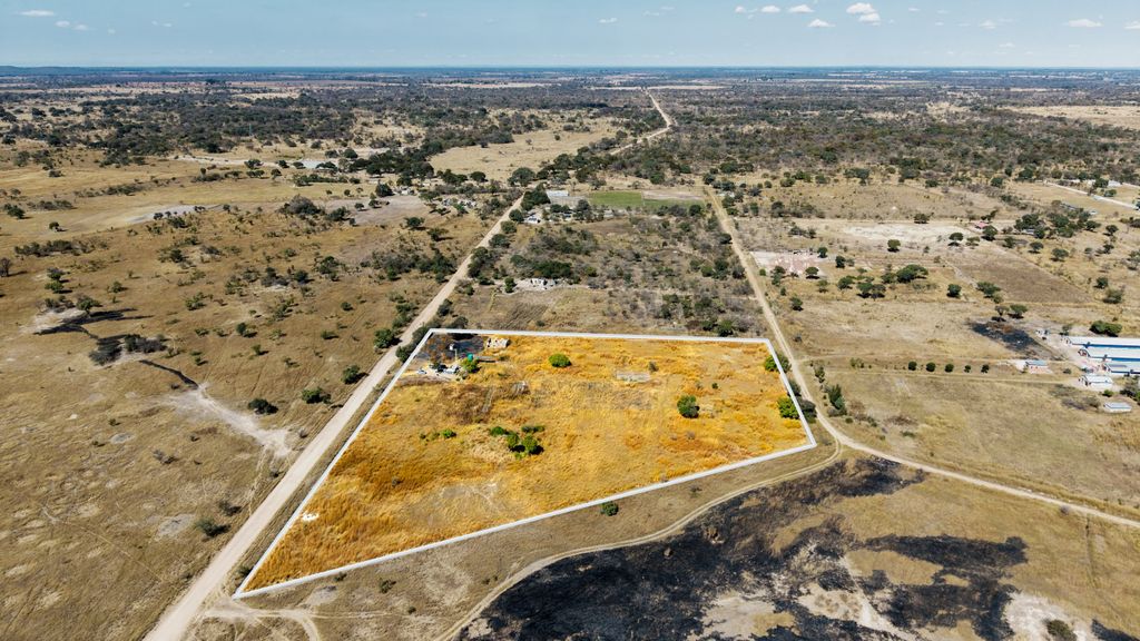 Property photo 2 of 2 Aerial View Of A Dry Rural Landscape With A Fenced Rectangular Plot Outlined In White, Containing Sparse Vegetation And A Few Buildings Nearby.
