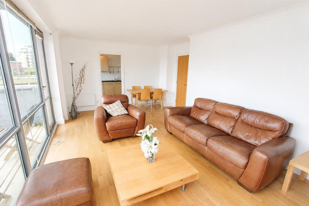 Property photo 2 of 9 Bright Lounge With Leather Sofas And Big Windows...