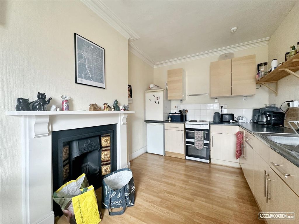 Property photo 3 of 12 Bright Kitchen With A Charming Feature Fireplace...