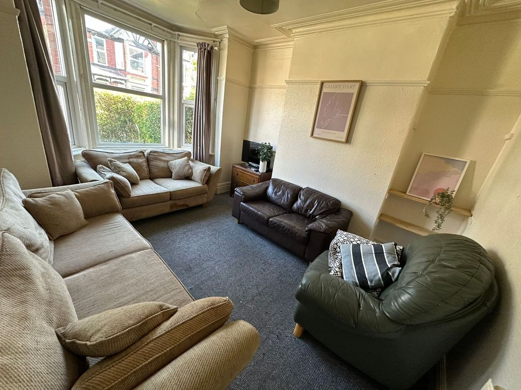 Property photo 3 of 18 Spacious And Bright Living Room Featuring A Large ...