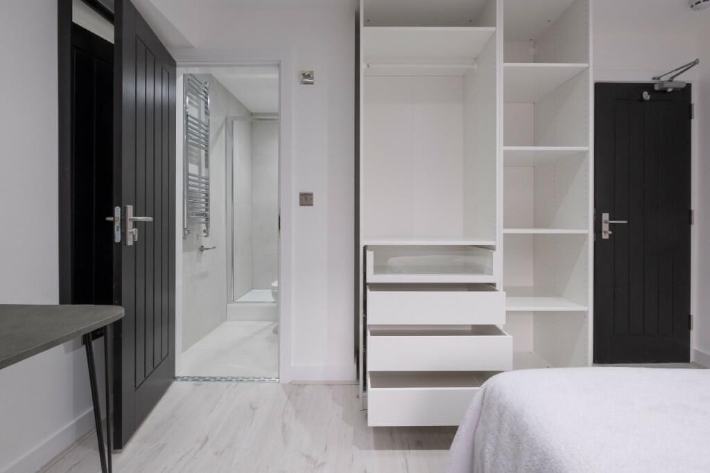 Property photo 1 of 15 A Bright And Modern Master Bedroom Featuring A Spa...