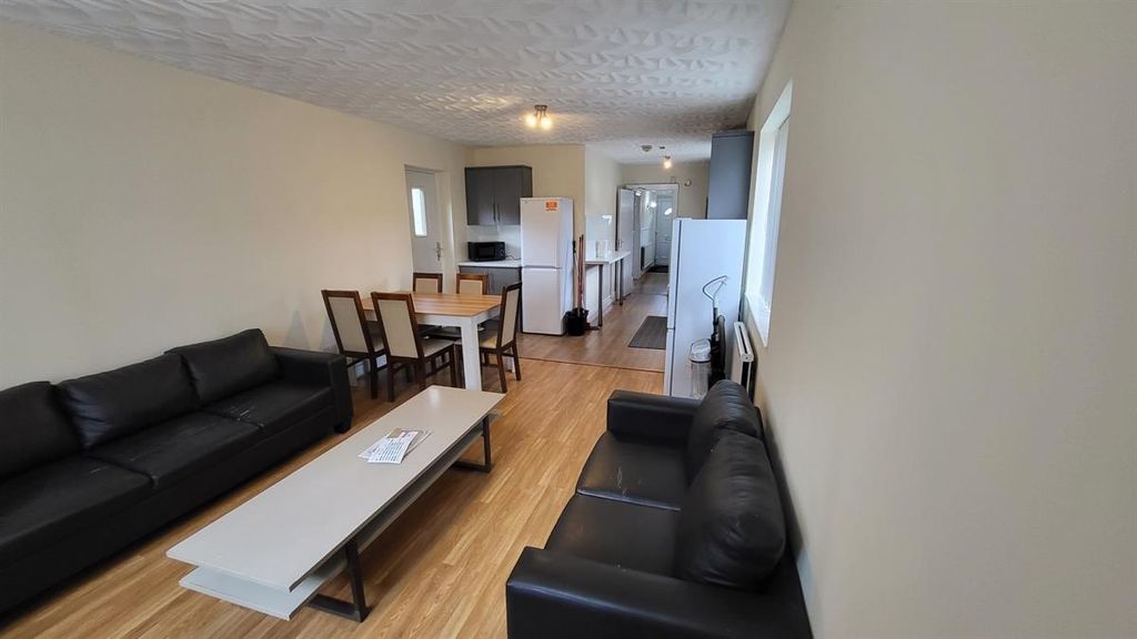 Property photo 1 of 15 Bright, Modern Living Room With Comfortable Black ...