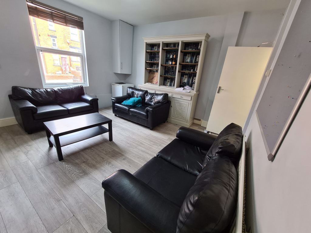 Property photo 3 of 19 A Spacious And Well-Lit Living Room Featuring Mode...