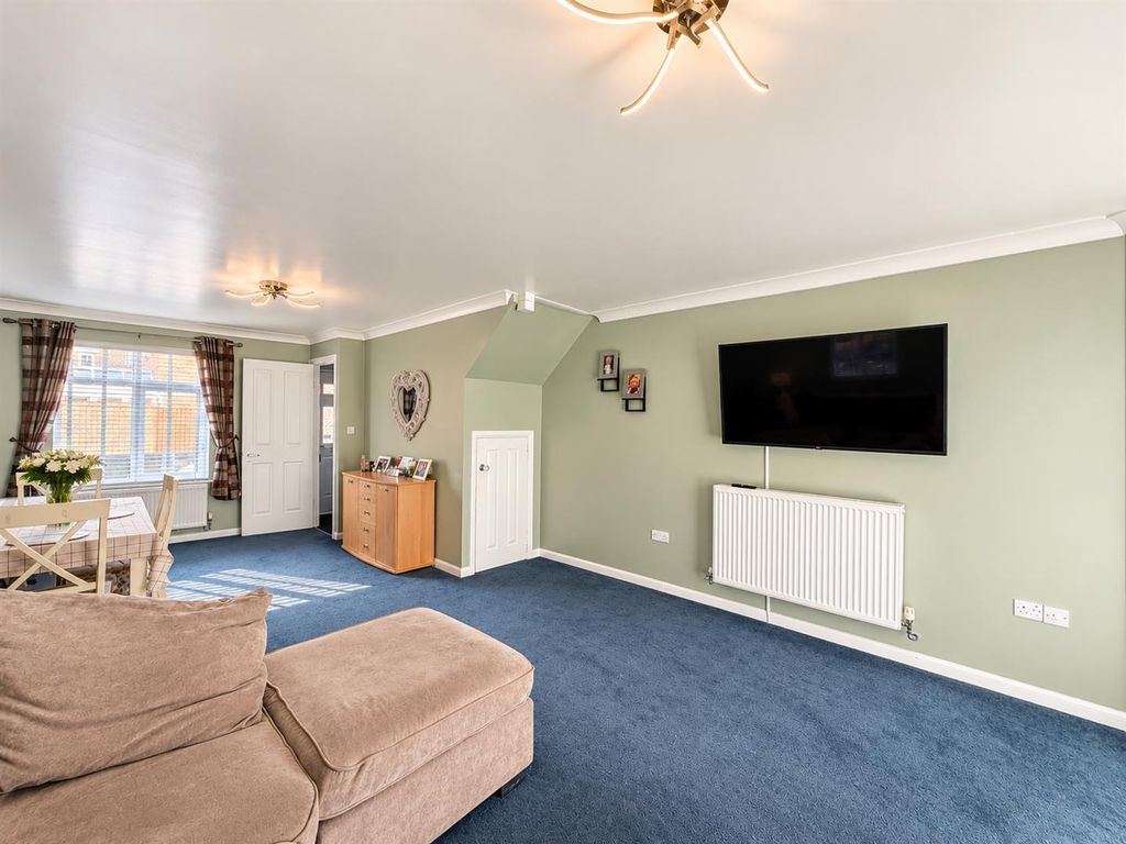 Property photo 2 of 13 Sage Green Living Room With Blue Carpet.Png