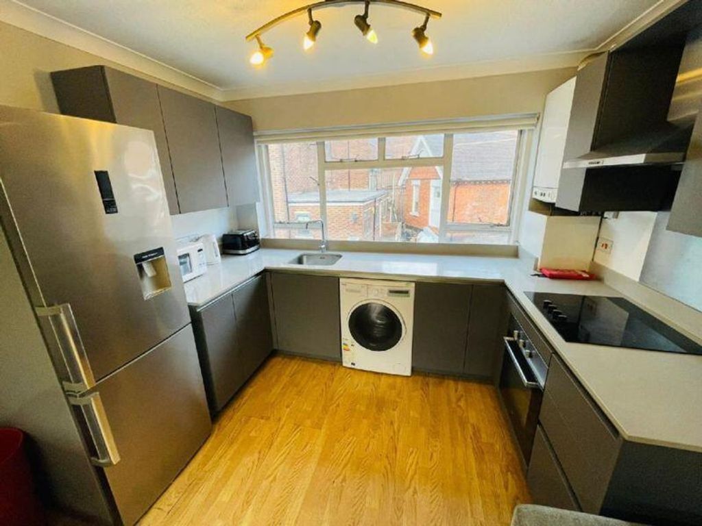 Property photo 3 of 10 A Modern And Spacious Kitchen Featuring Ample Stor...